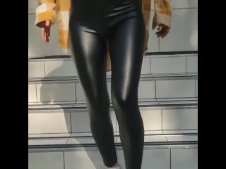 sexy legs of a girl in leather leggings