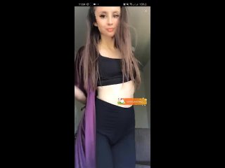 a young girl in leggings twists her booty on camera
